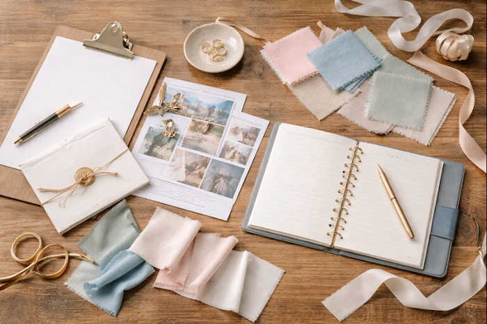 Italy wedding planning workspace with color swatches and simple stationery.